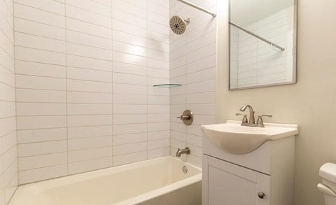Bathroom with updated vanity and white subway tiles